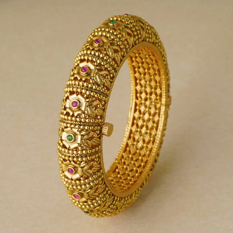 Intricate gold plated stone kada bangle